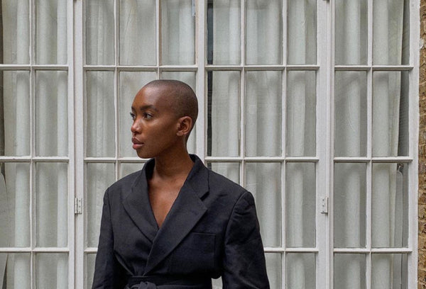 Marisa Martins, instagram influencer, fashion stylist, founder and change-maker, wearing a black, minimalist suit