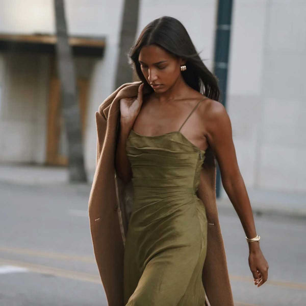 Jasmine Tookes in the Aje Clarice Pleated Maxi Dress in olive green linen from Rites