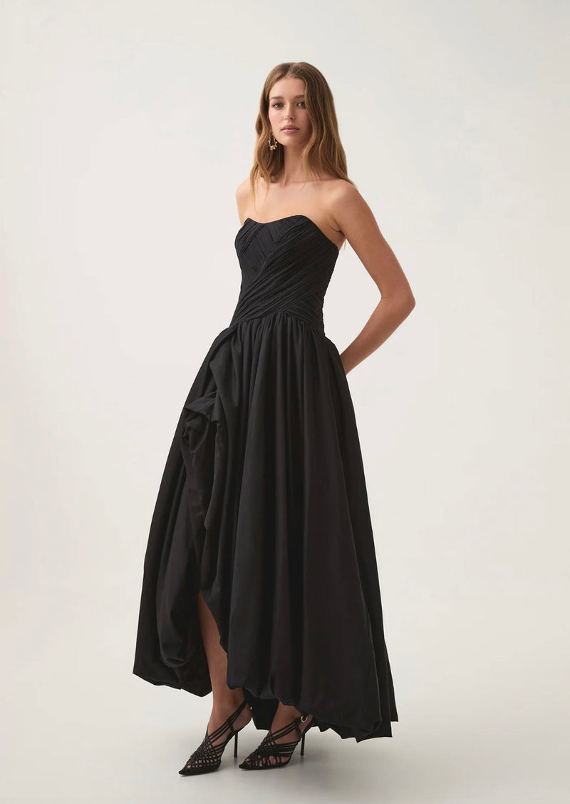 Rent the black Aje Spatial Asymmetric Strapless Maxi Dress at Rites