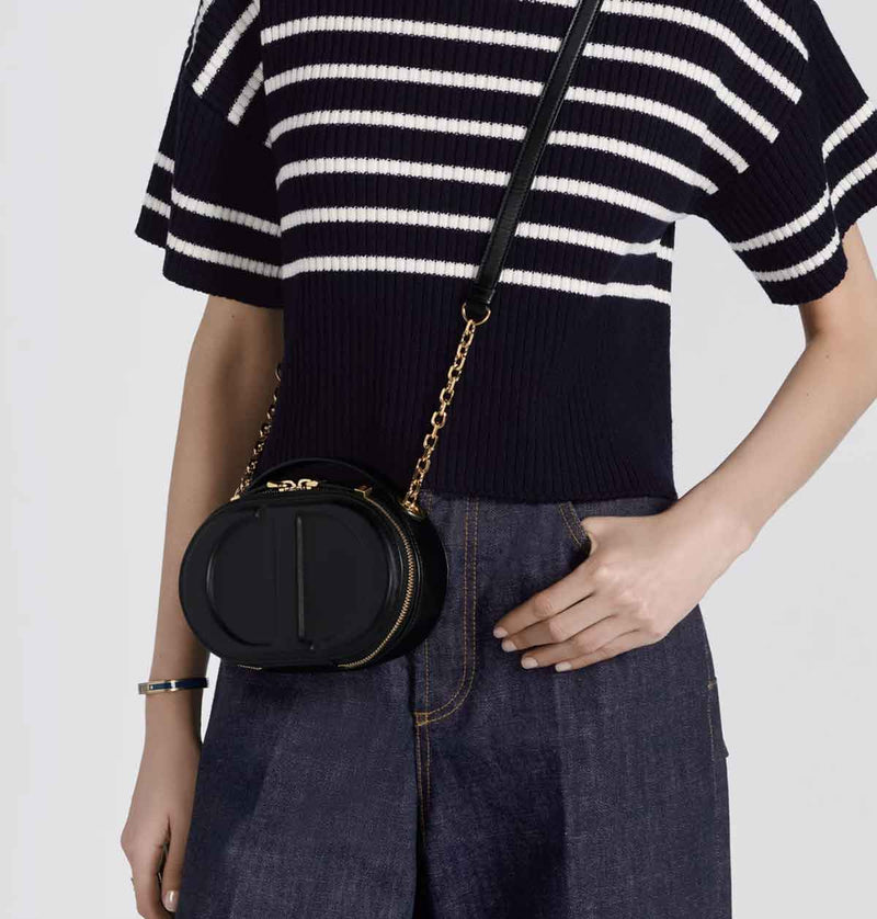 Shop the black CD Signature Oval Camera Bag by Dior at Rites London