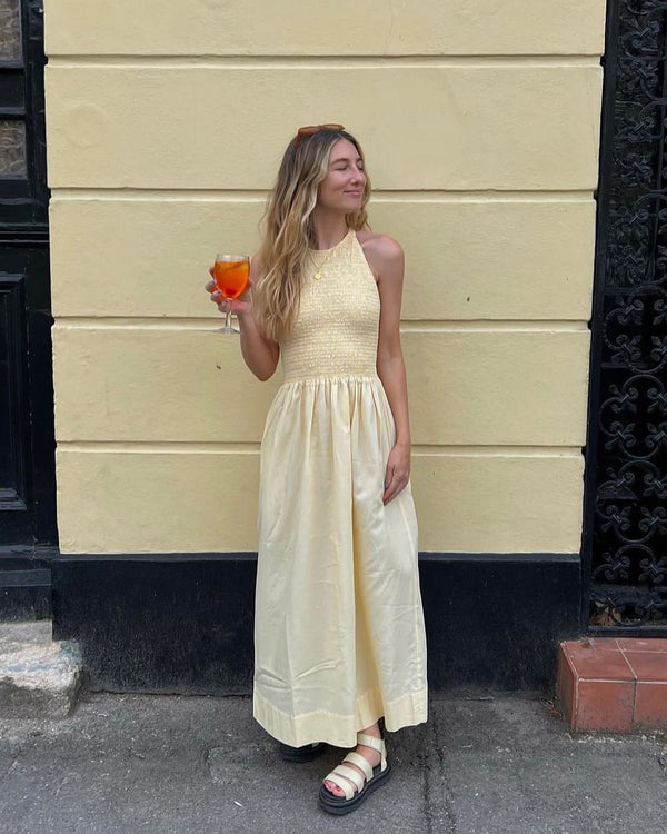 Rent the Soleil Dress in primrose yellow by Three Graces at Rites